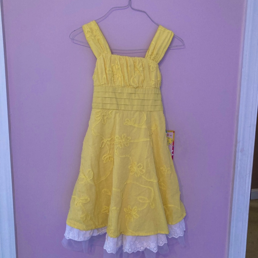 A yellow summer dress with White Net frill/lace at the bottom. Age 10 - girls.